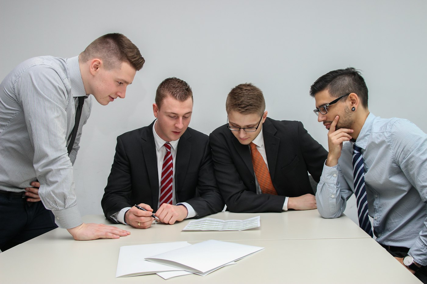 Colleagues reviewing documents together
